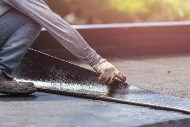 Professional Basement Waterproofing technician working in Tullytown, PA